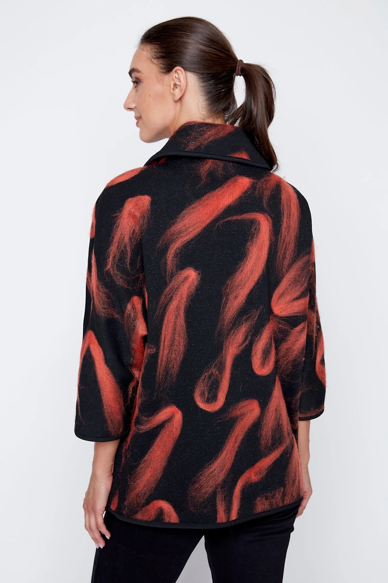 La veste en maille jacquard floconnée