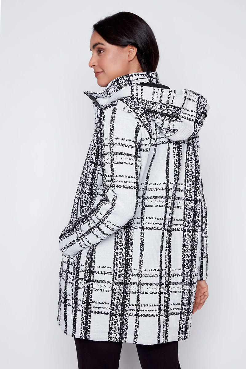 Le manteau à carreaux capuche