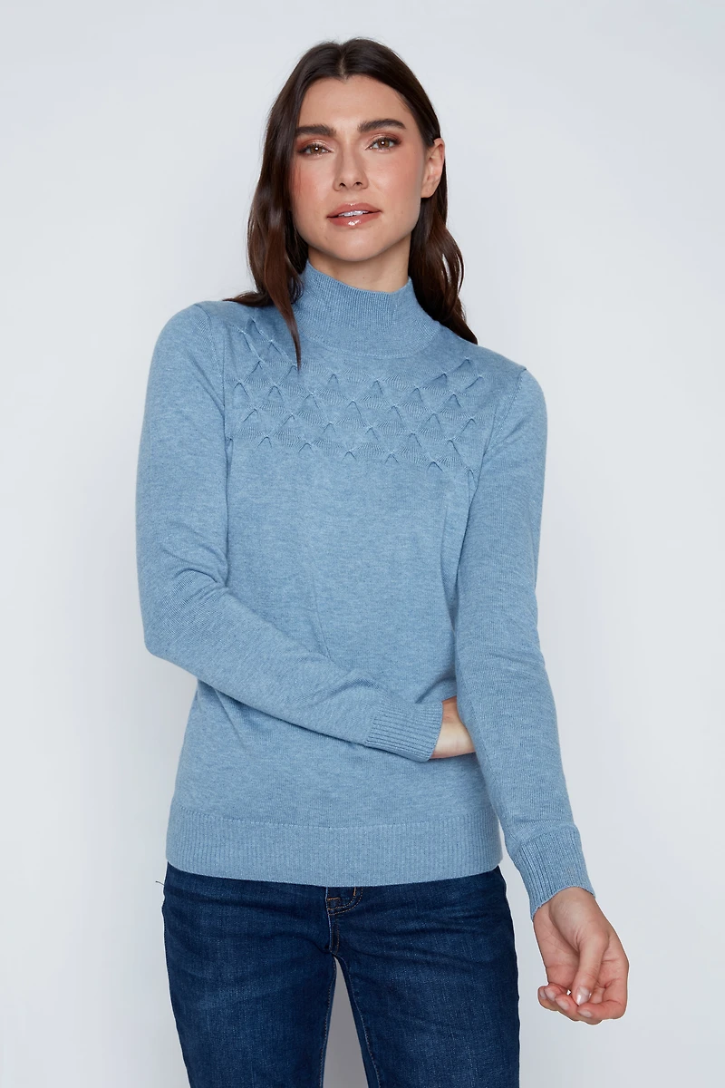 Le pull en coton mélangé à torsades nid d'abeille