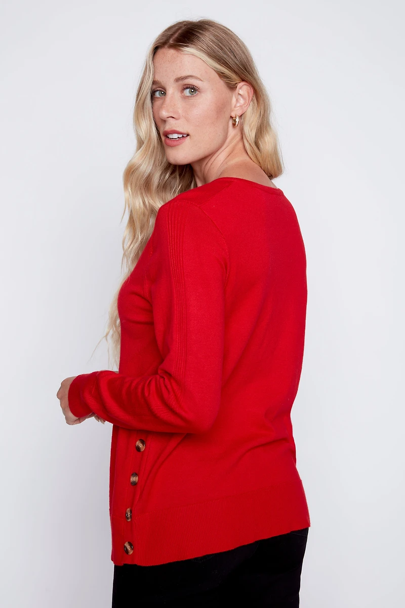 Le pull à boutons latéraux