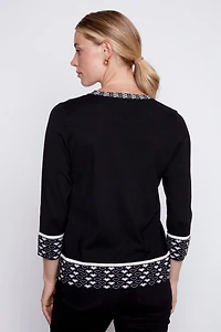 Le pull à bordure motif de cœur