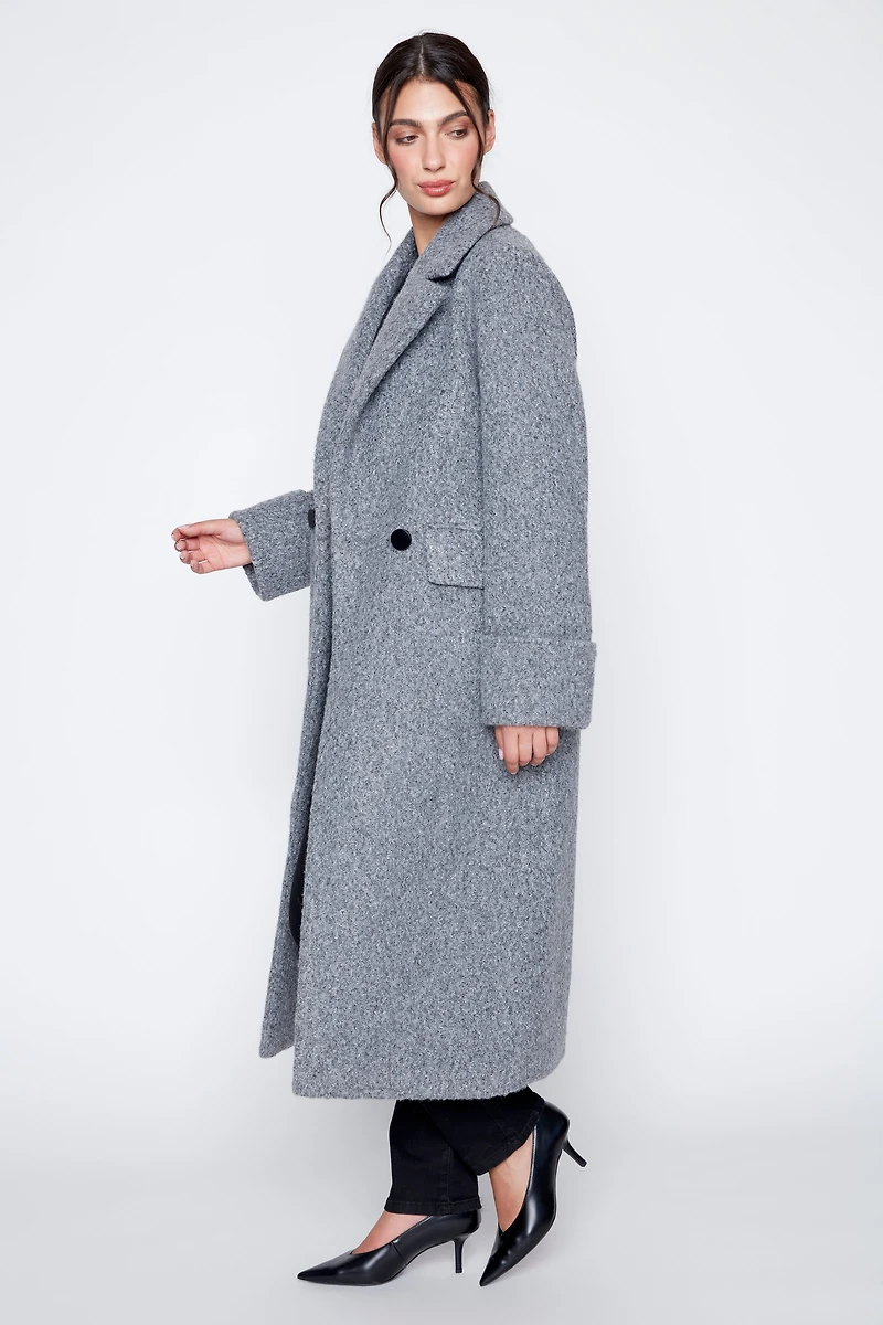Le manteau bouclé double boutonnage