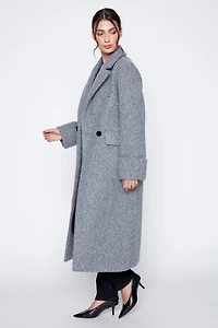 Le manteau bouclé double boutonnage