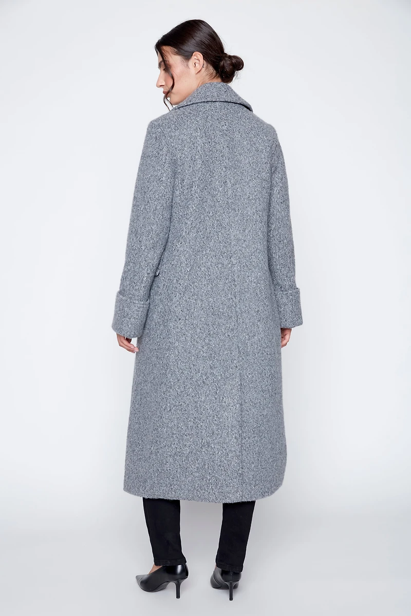 Le manteau bouclé double boutonnage