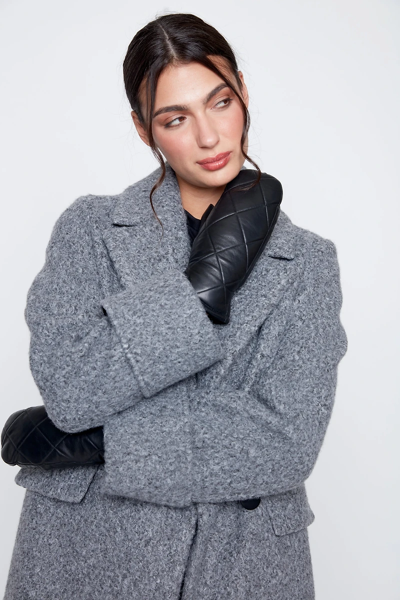 Le manteau bouclé double boutonnage