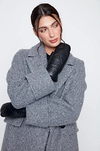 Le manteau bouclé double boutonnage