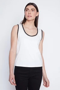 Le haut côtelé à bordure crochetée