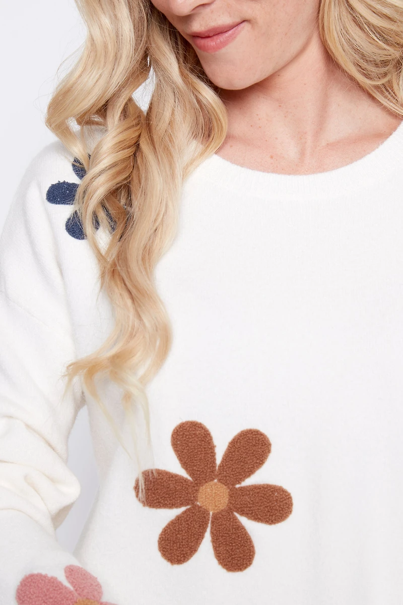 Le pull avec fleurs bouclé