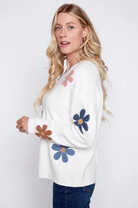 Le pull avec fleurs bouclé