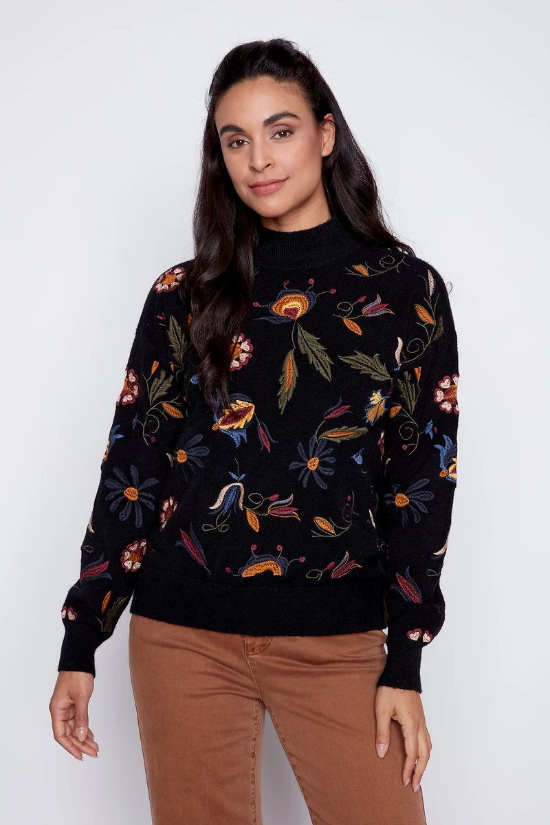 Le pull brodé de feuilles florales