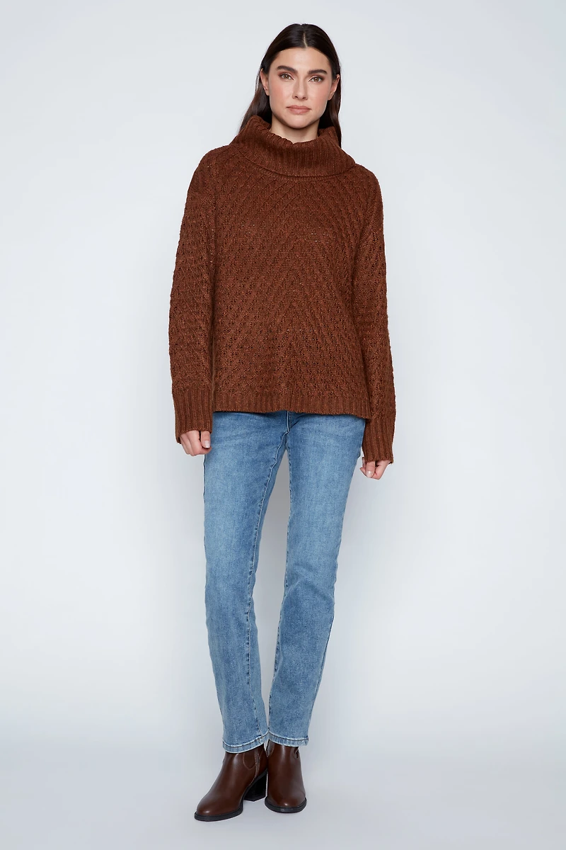 Le pull côtelé à torsades diagonales