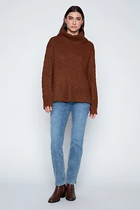 Le pull côtelé à torsades diagonales