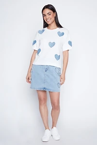 Le pull à motif coeur