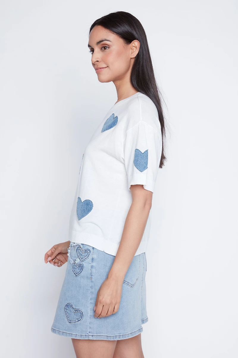 Le pull à motif coeur