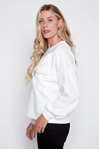 Le pull fleuri avec appliques diamantées