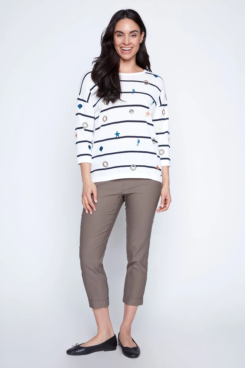 Le pull à motif monde marin