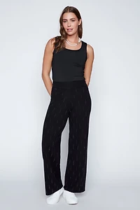 Le pantalon jambe large avec détails en strass