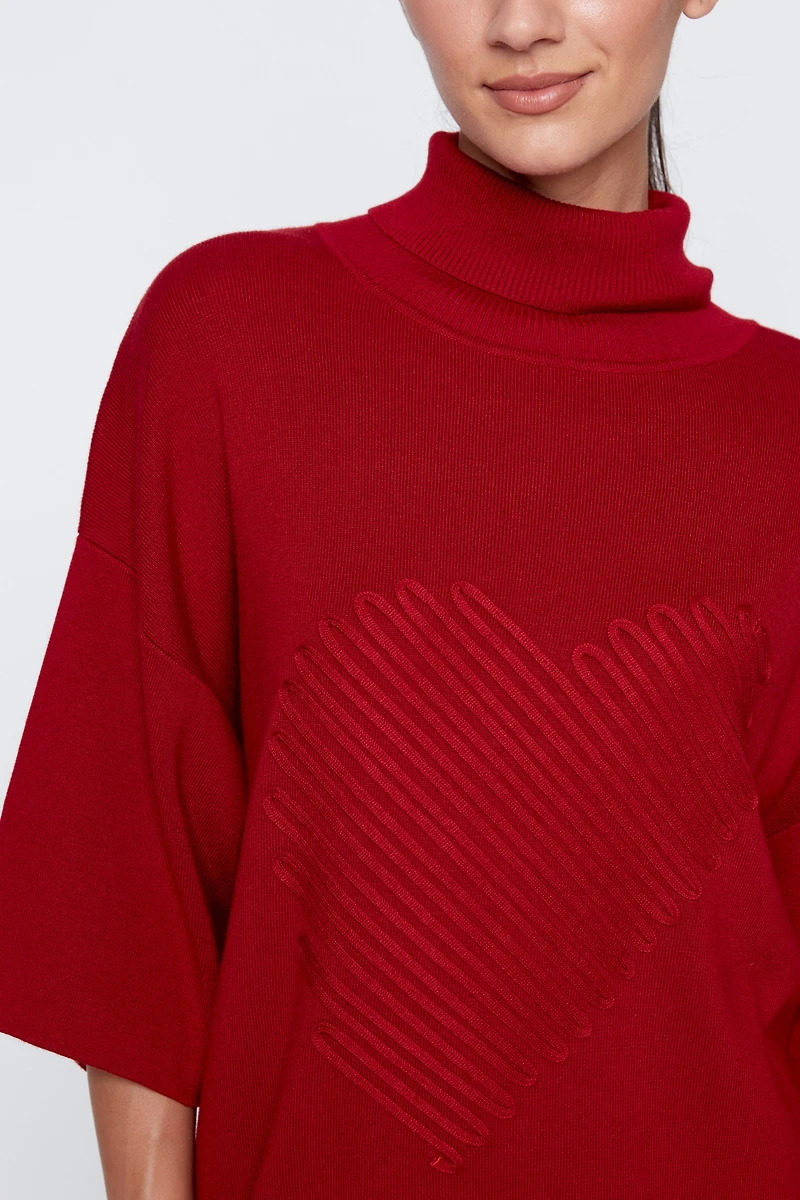 Le pull avec détails de cœur
