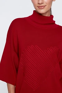 Le pull avec détails de cœur