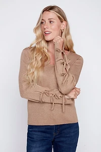 Le pull à détail nœud