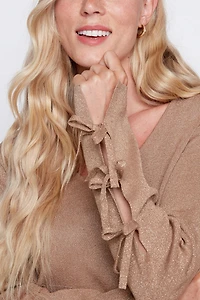 Le pull à détail nœud