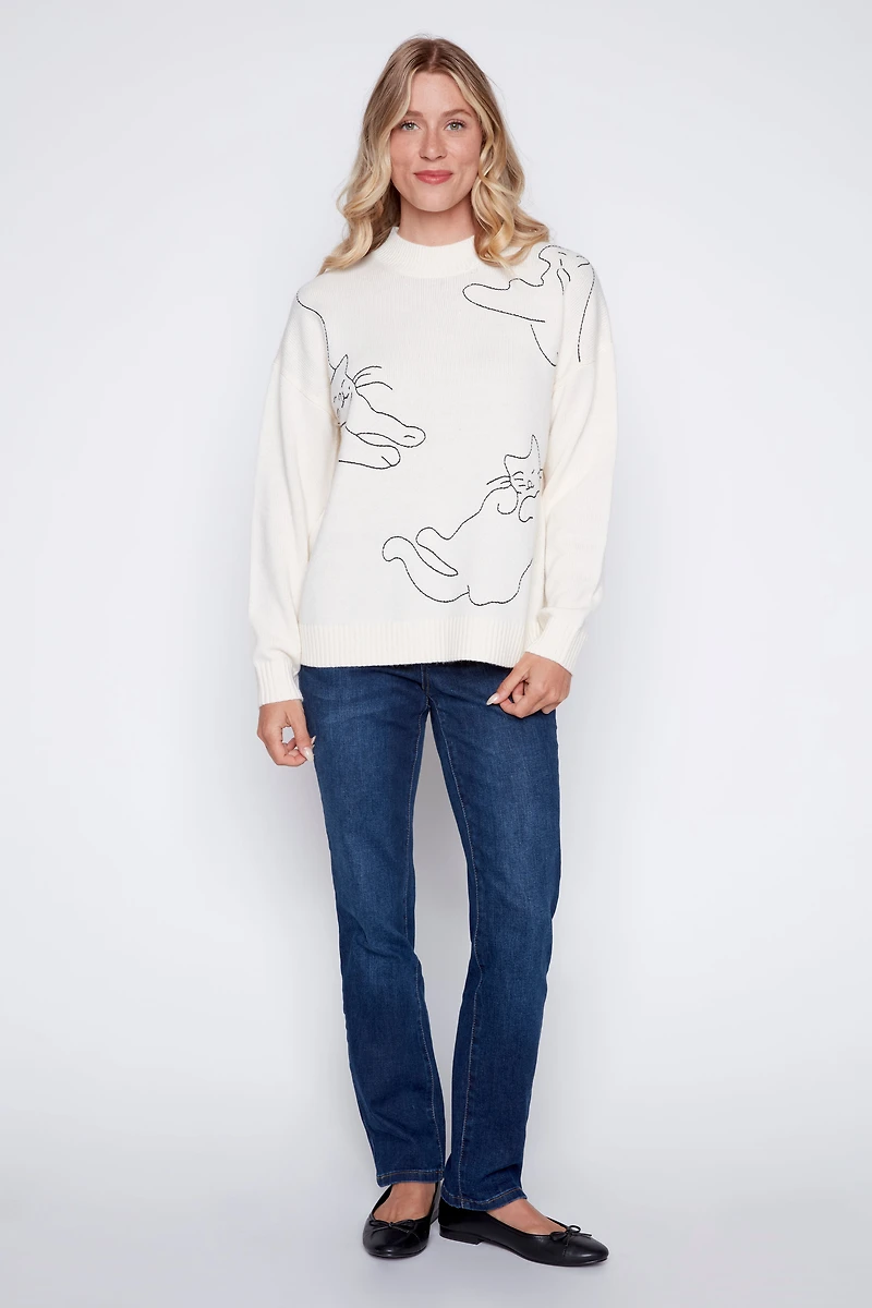 Le pull à motif chat
