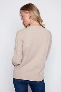 Le pull en tricot à motif trois chats