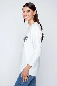 Textured bloom embossed top
