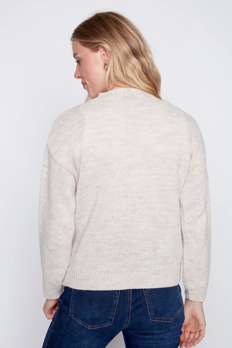 Le pull à motif ourson