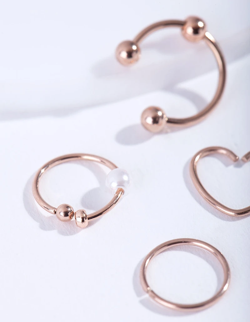 Pack de 4 bagues en acier chirurgical en or rose
