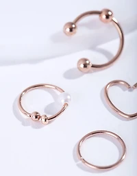 Pack de 4 bagues en acier chirurgical en or rose