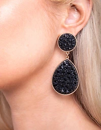 Boucles d’oreilles en forme de goutte noire ornées