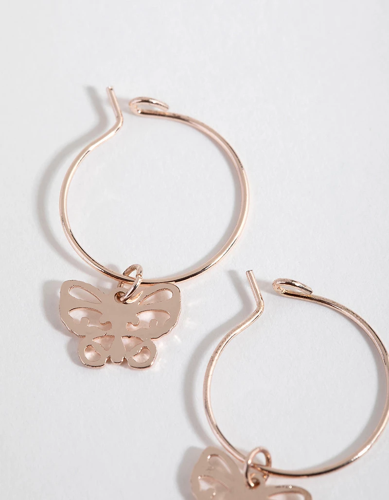 Boucles d’oreilles Huggie papillon découpées en or rose