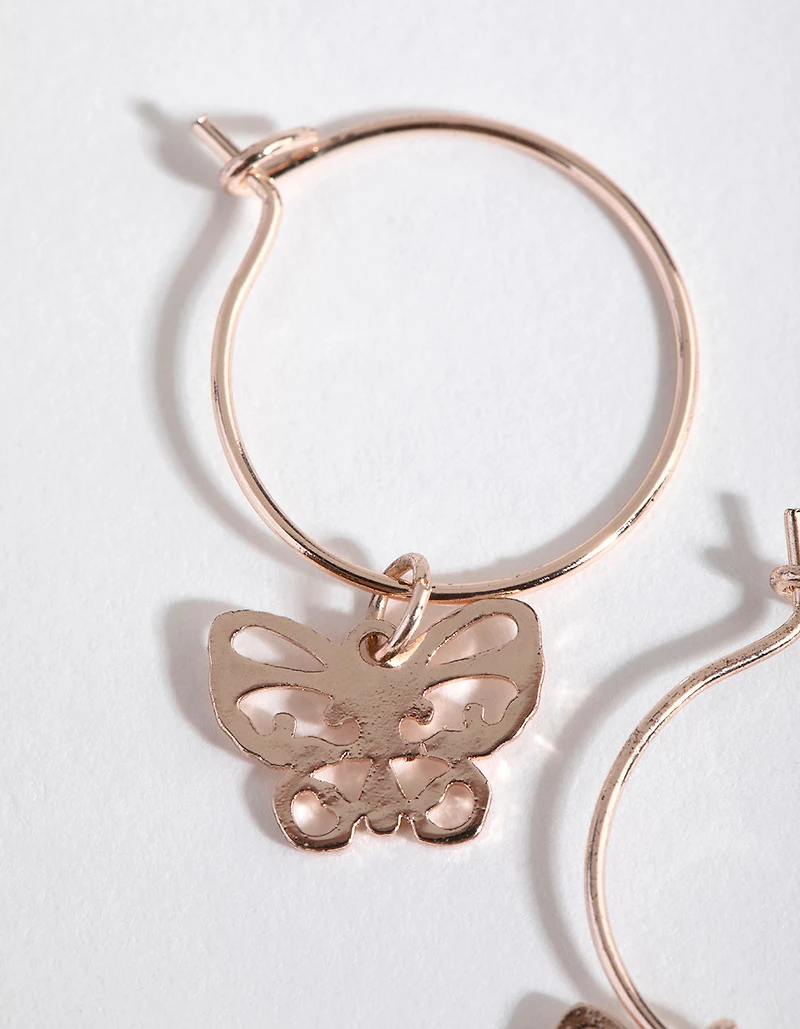 Boucles d’oreilles Huggie papillon découpées en or rose