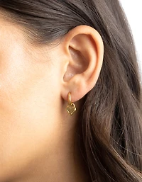 Boucles d’oreilles Huggie Huggie en acier chirurgical en acier doré