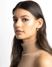Boucles d’oreilles Huggie Huggie en acier chirurgical en acier doré
