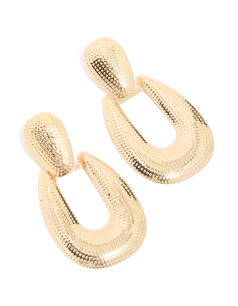 Boucles d’oreilles dorées à points texturés et tombantes
