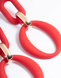Boucles d’oreilles tombantes à maillons recouvertes de caoutchouc rouge