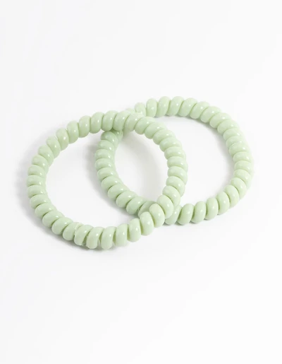 Sachet spiralé en plastique vert pour cheveux étroits