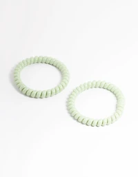 Sachet spiralé en plastique vert pour cheveux étroits