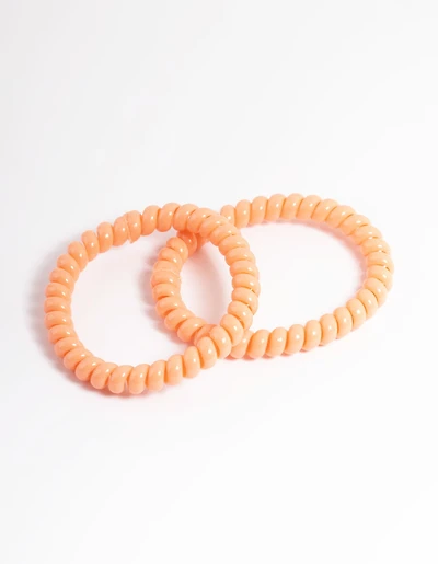 Pack spiralé en plastique orange pour cheveux étroits