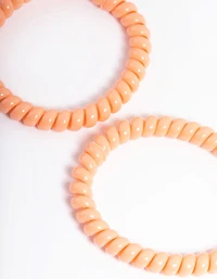Pack spiralé en plastique orange pour cheveux étroits