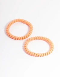 Pack spiralé en plastique orange pour cheveux étroits