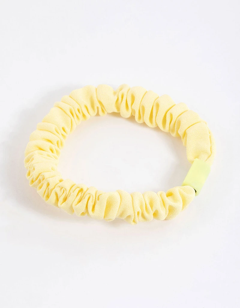 Scrunchie mince à pince en tissu jaune