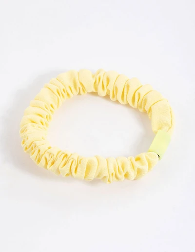 Scrunchie mince à pince en tissu jaune