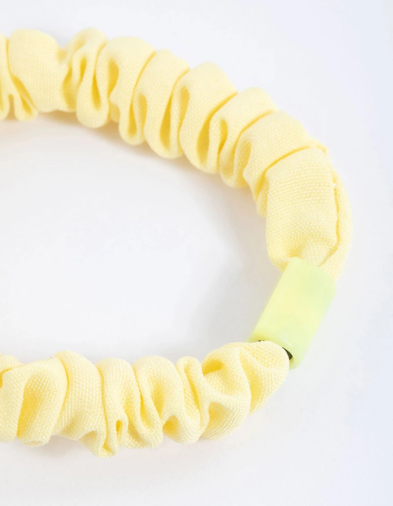Scrunchie mince à pince en tissu jaune