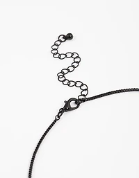 Collier à chaîne noire recouverte de grandes croix en pierre