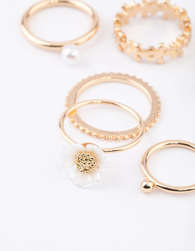 Pack de 6 bagues en fleur perle dorée