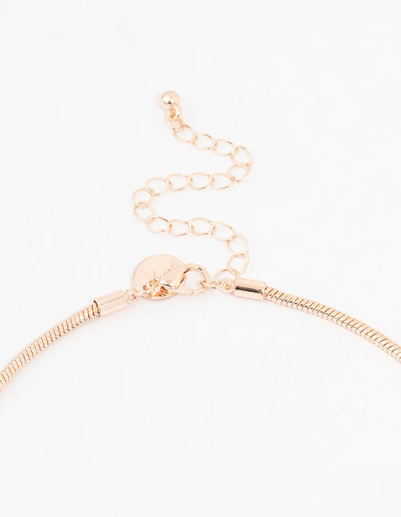 Collier chaîne à pompons en or rose