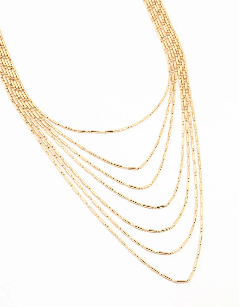Collier en or superposé